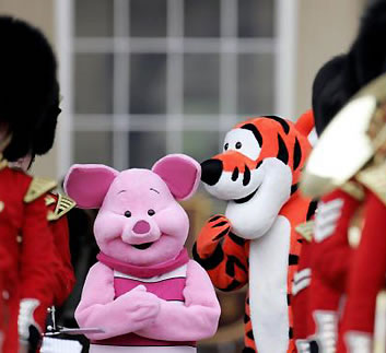 Piglet and Tigger from the 'Winnie the Pooh' books join in with the Changing the Guard ceremony prior to the Children's party. 
